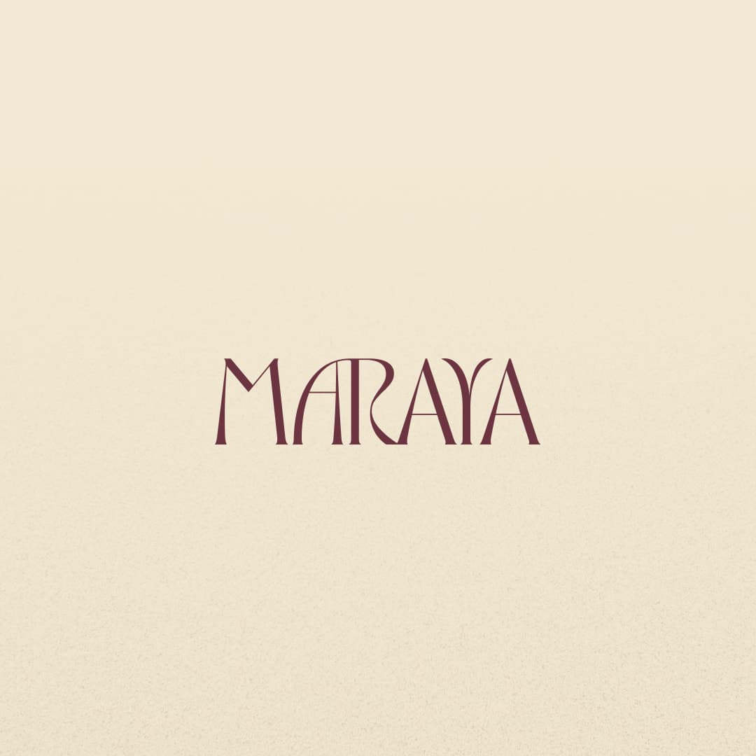 Maraya wordmark in wine on a sand background