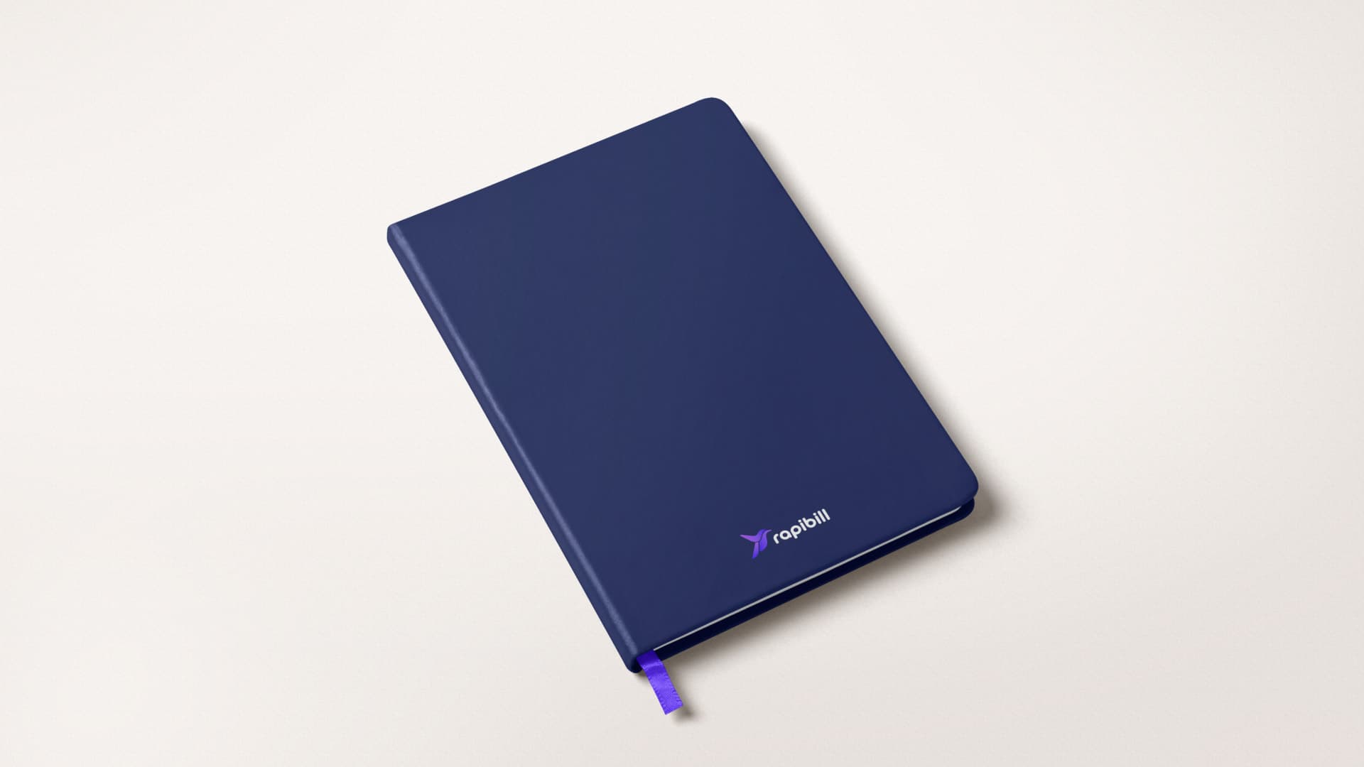 Navy notebook with the Rapibill logo
